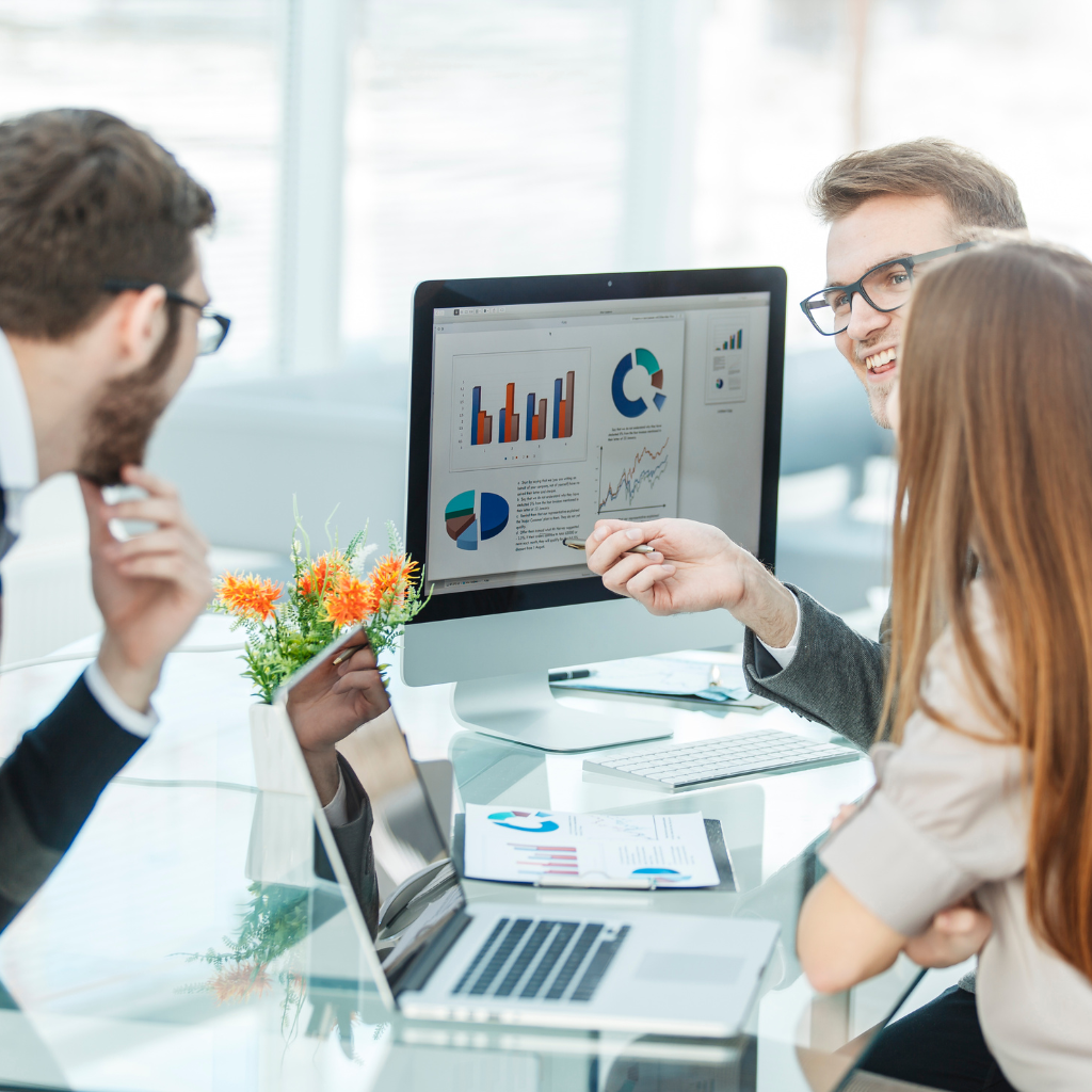 A digital marketing agency team working on online strategies for startups, with laptops, analytics charts, and brainstorming sessions.