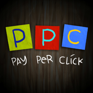 Illustration of PPC (Pay-Per-Click) with colorful letters on a wooden background, representing online advertising.