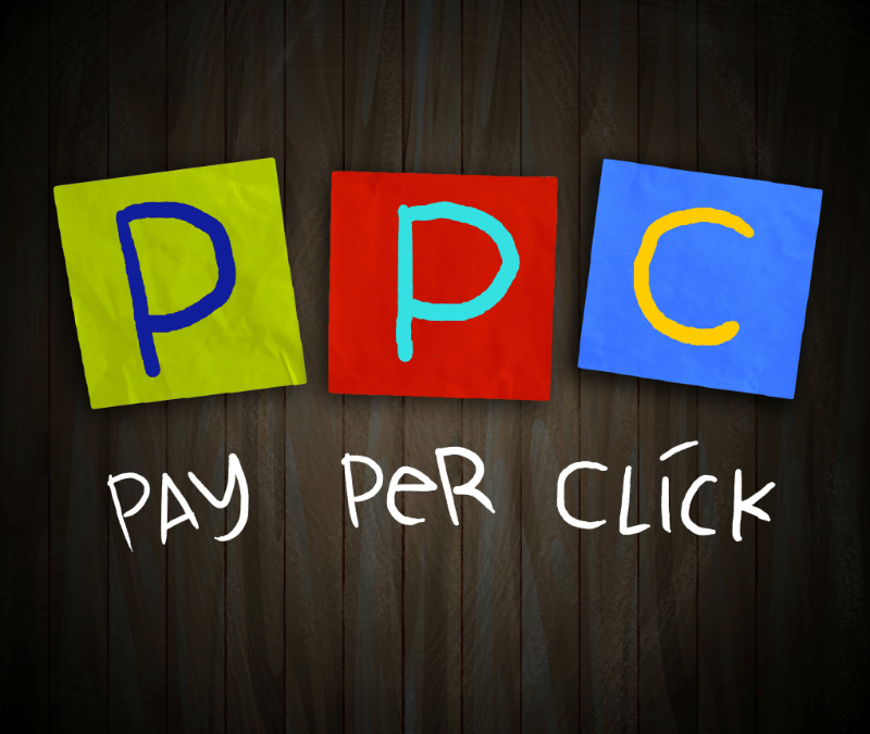 Illustration of PPC (Pay-Per-Click) with colorful letters on a wooden background, representing online advertising.